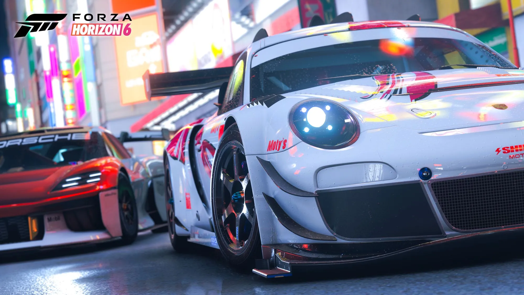Coche deportivo con neones en una avenida urbana de Tokio en Forza Horizon 6